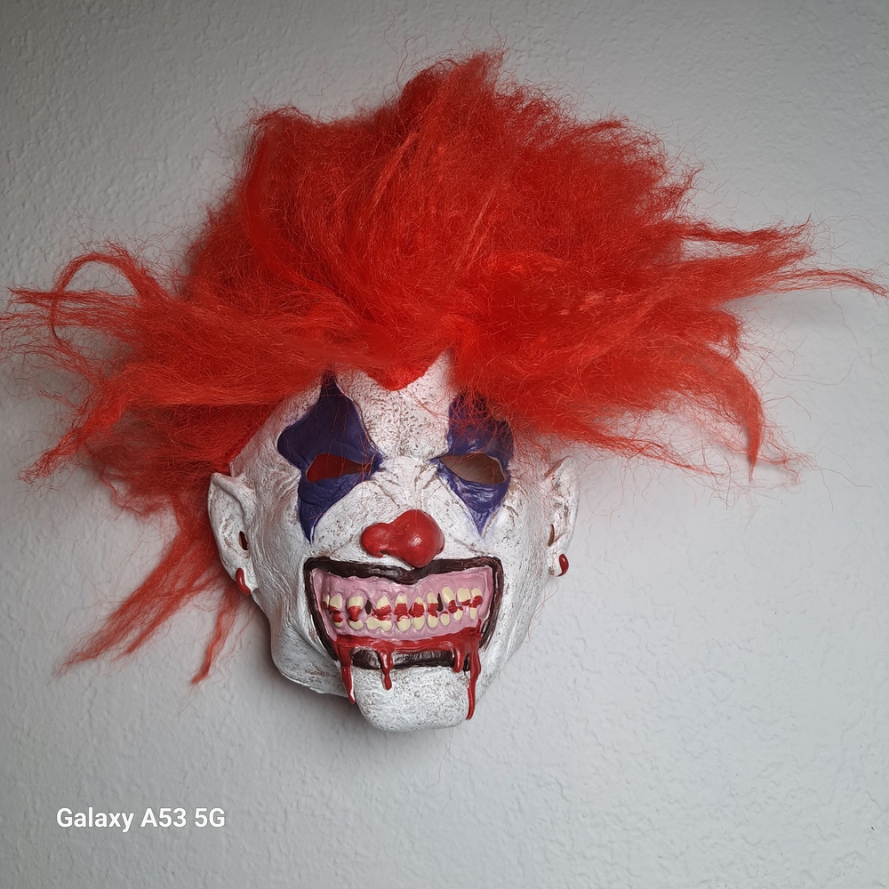 Spirit Halloween Mask with Vibrant Red Hair